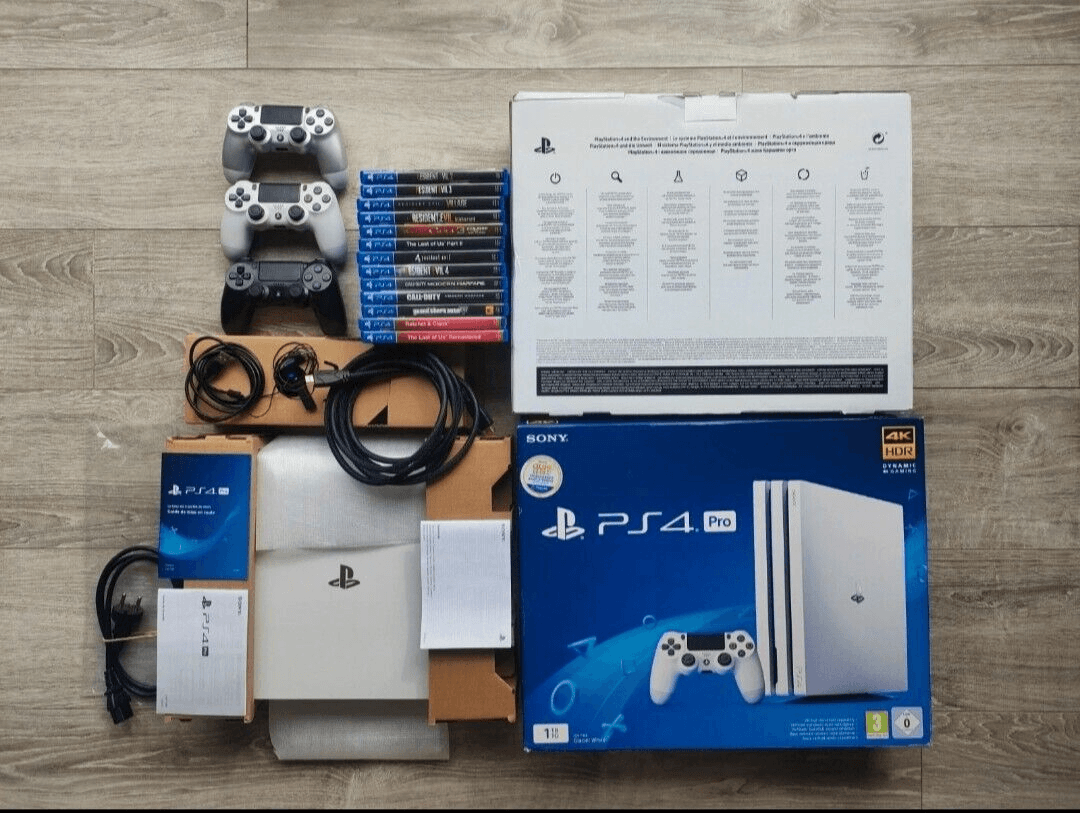 Sony PlayStation PS4 Pro - 1To - Blanc Glacier + 13 Jeux - Photo 1