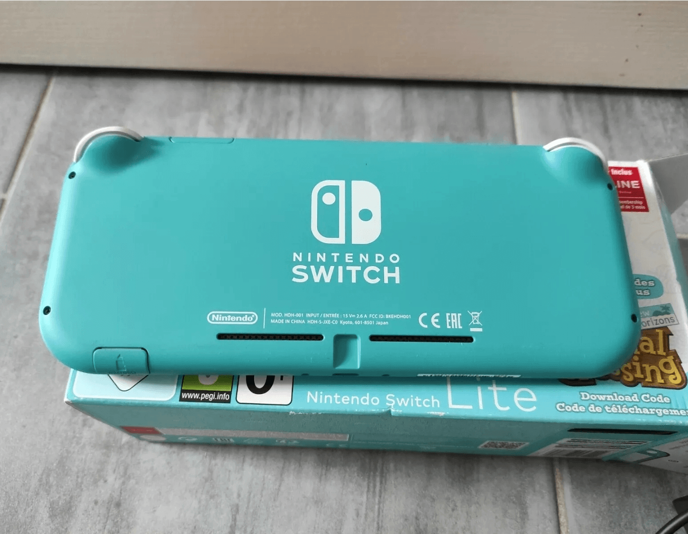 Console portable Nintendo Switch Lite turquoise état neuf - Photo 1