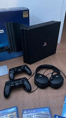 Sony PlayStation 4 Pro 1To Très bon état, 8 Jeux + 2 Manettes - Photo 1